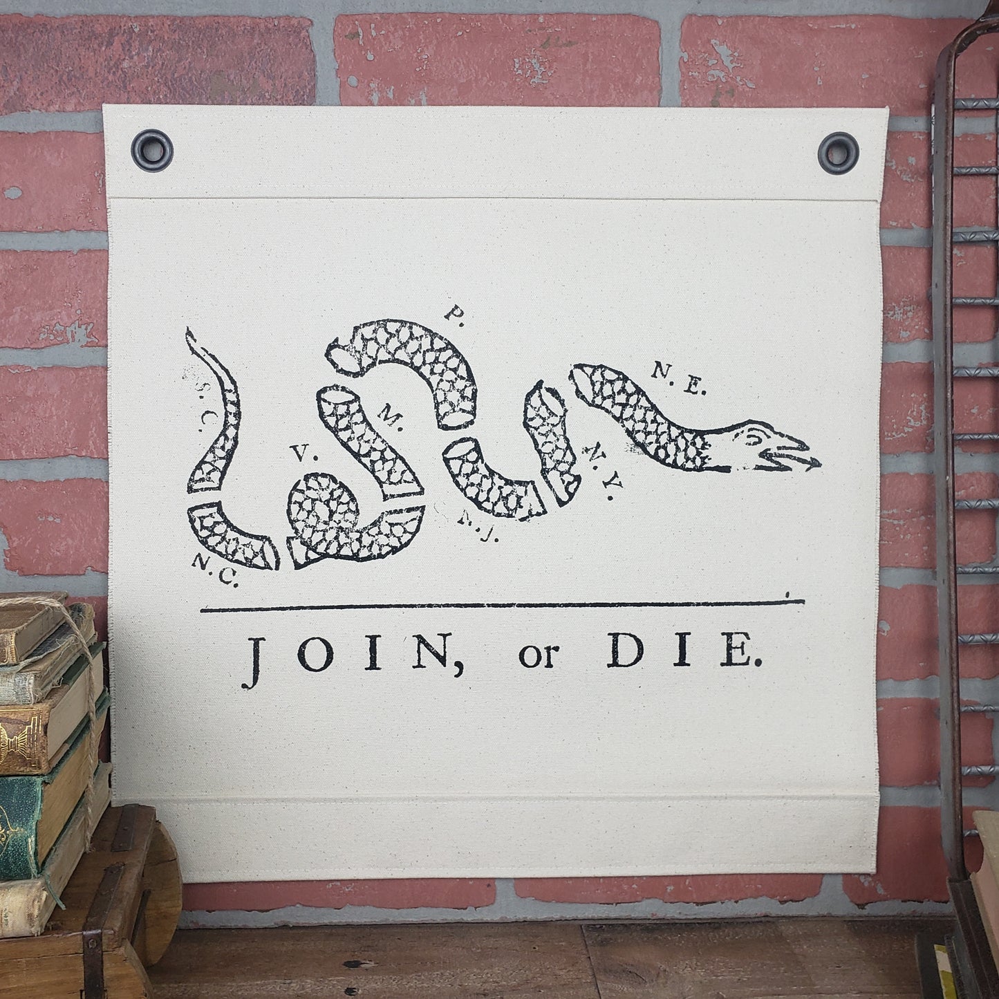 Inked Canvas wall hanging or wall art featuring vintage image of the infamous political cartoon "Join, or Die" published in the Pennsylvania Gazette by Ben Franklin in 1754. Hand made in the USA using natural 100% Cotton Heavy Canvas. Free POCKET CONSTITUTION/DECLARATION OF INDEPENDENCE with purchase!