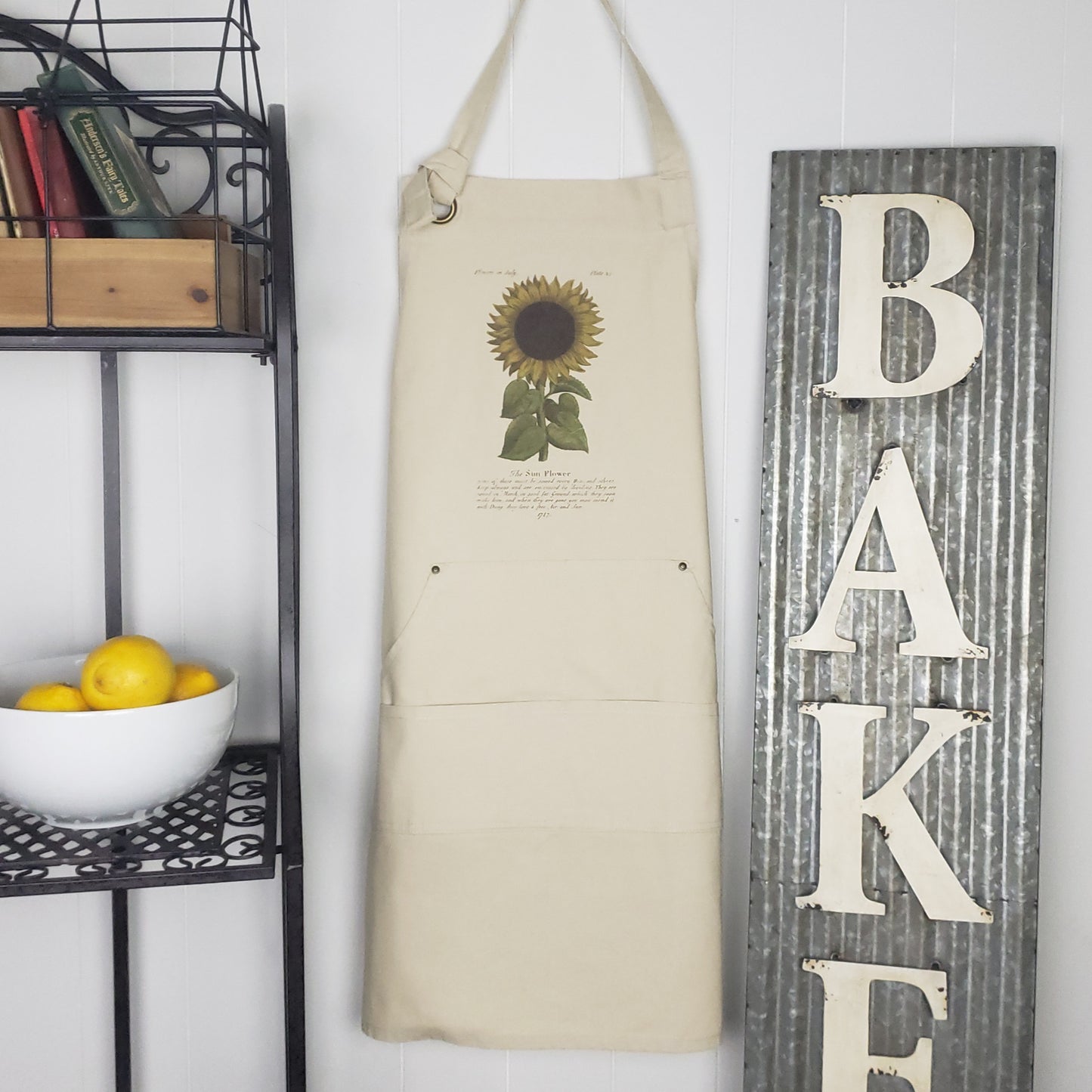 Grab yourself one of these pretty sunflower heavy duty bib aprons! This charming Sunflower image from 1747 includes some tips on growing Sunflowers. Sow seeds each March and, don't forget, the Sunflower loves Free Air & Sun! Designed and Printed in Boise, Idaho, USA