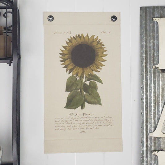 Inked Canvas wall hanging, wall decor, wall art featuring this charming Sunflower image from 1747 included the suggestion to sow seeds each March. According to the artist, the Sunflower loves Free Air & Sun! . Hand made in the USA by Heart in Hand Mercantile using natural, unbleached 100% Cotton Heavy Duck Canvas.